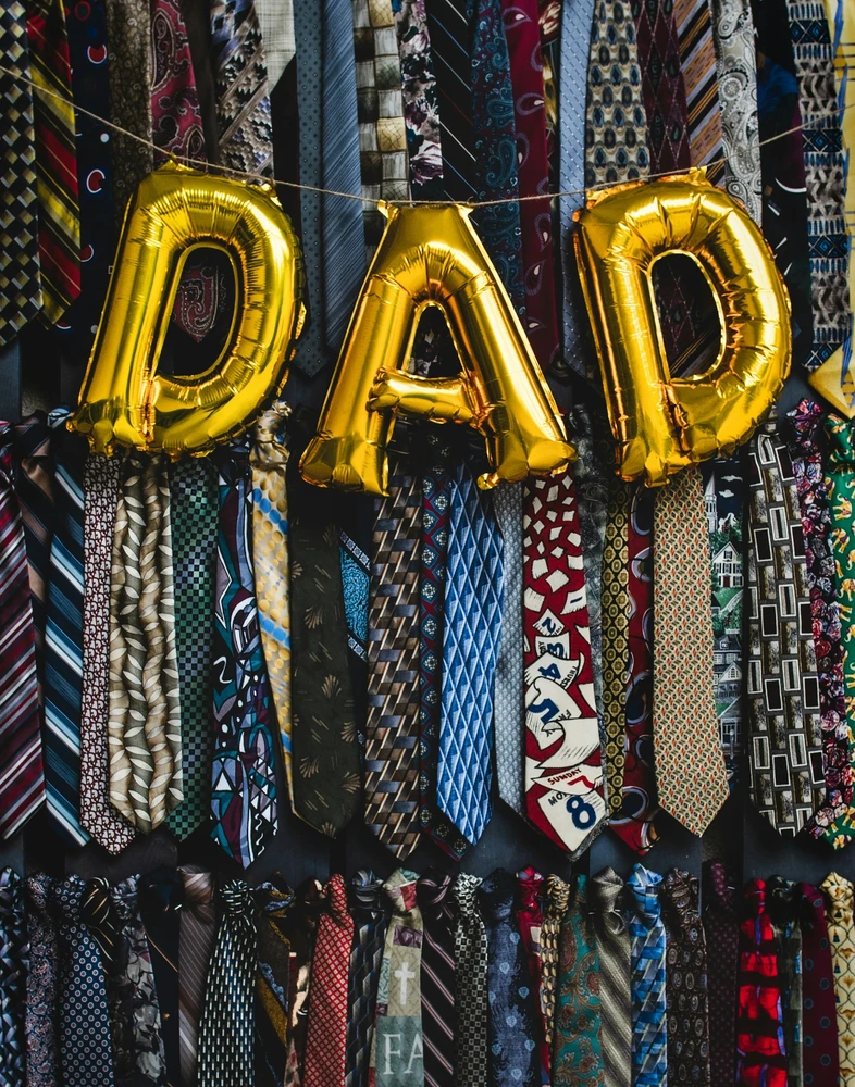 Dad balloon hanging from ties